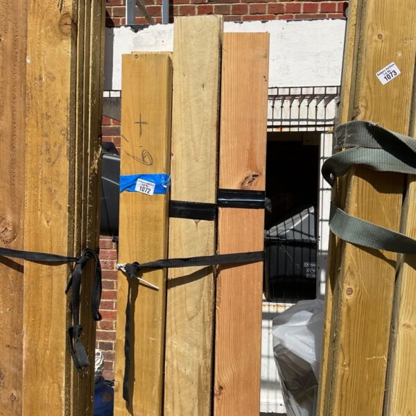 Stacked timber bundles ready for construction projects.