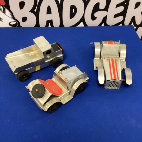Vintage tin plate Nigel vehicles in green, collectible toy cars.