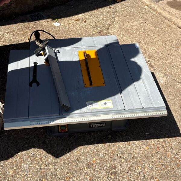 Portable Titan table saw with sliding miter function for woodworking.