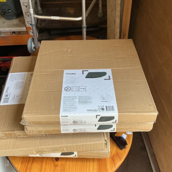 Two Tivano 15kg parasol bases in original packaging.