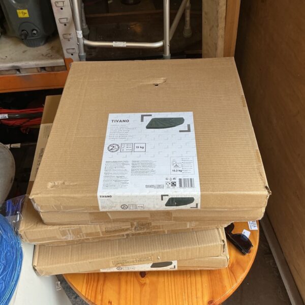 Two Tivano parasol bases in original packaging, ready for garden use.