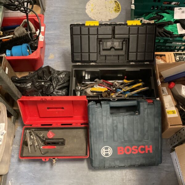 Red cantilever toolboxes with Bosch drill case and batteries.