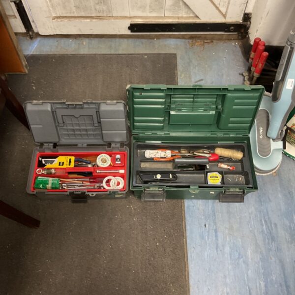 Open tool box set with screwdrivers and pliers inside.