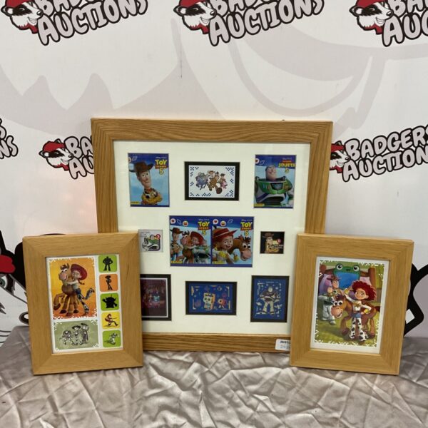 Three framed Toy Story prints for wall decor.