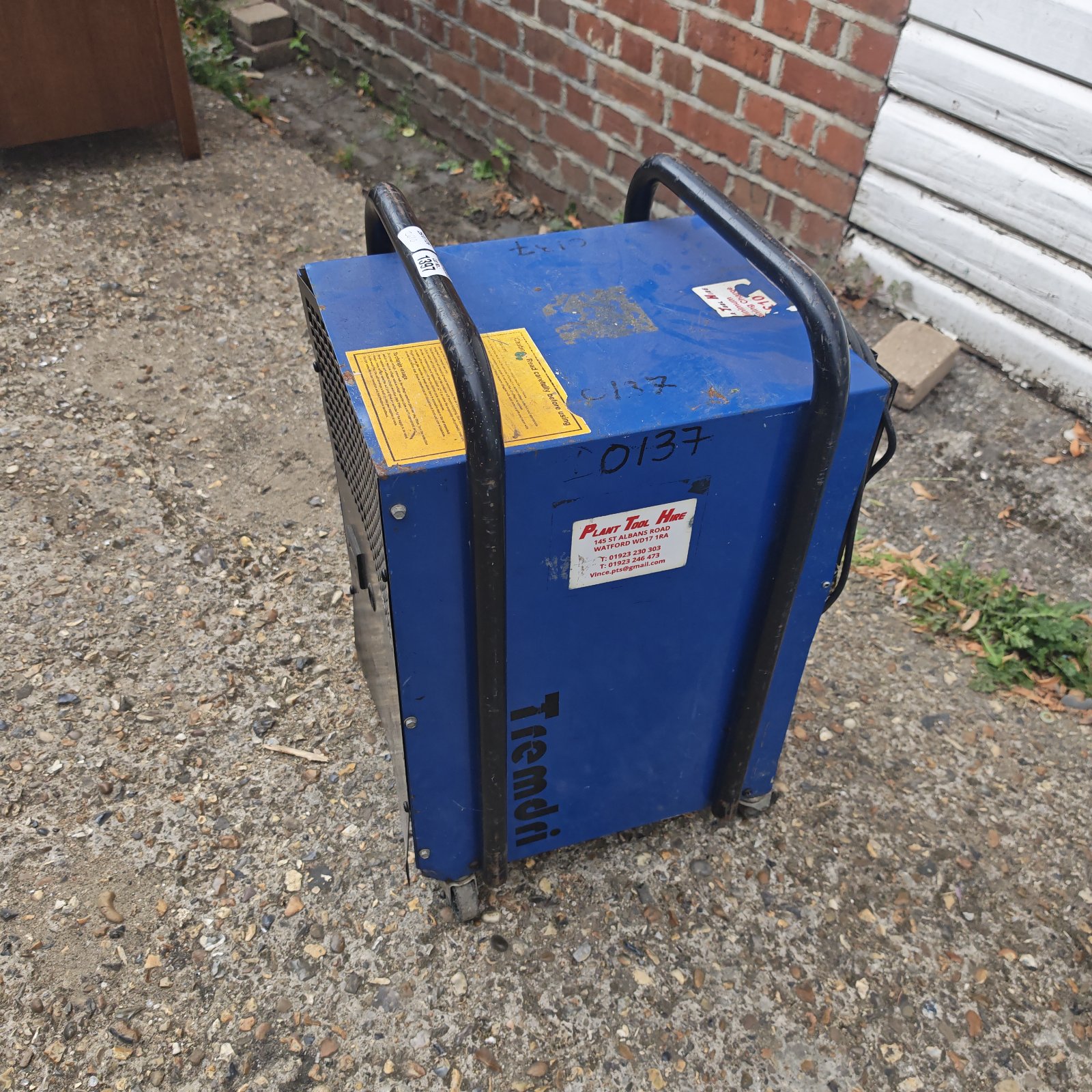 Used Tremdri diesel workshop heater with visible wear and rust.