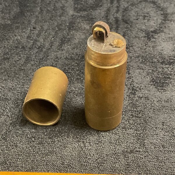 Vintage brass trench art lighter disassembled.