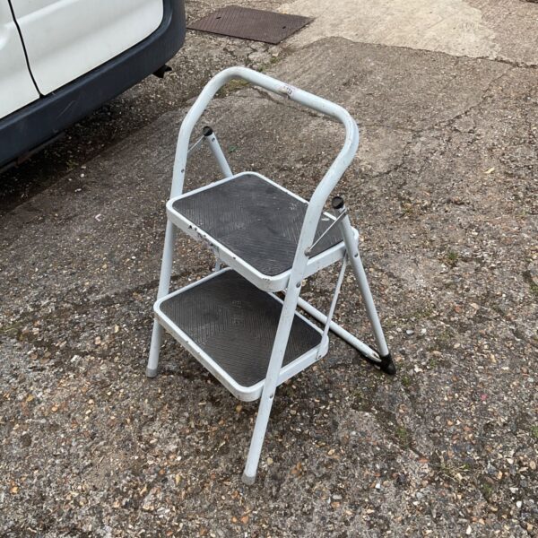 Vintage metal two step ladder for home use.