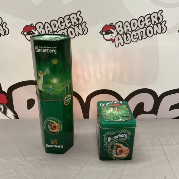 Two sealed Underberg bottles in tin packaging, collectible herbal liqueur.