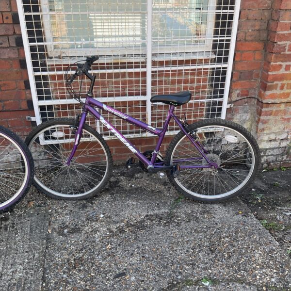 Purple Universal mountain bike, vintage cycle for restoration.