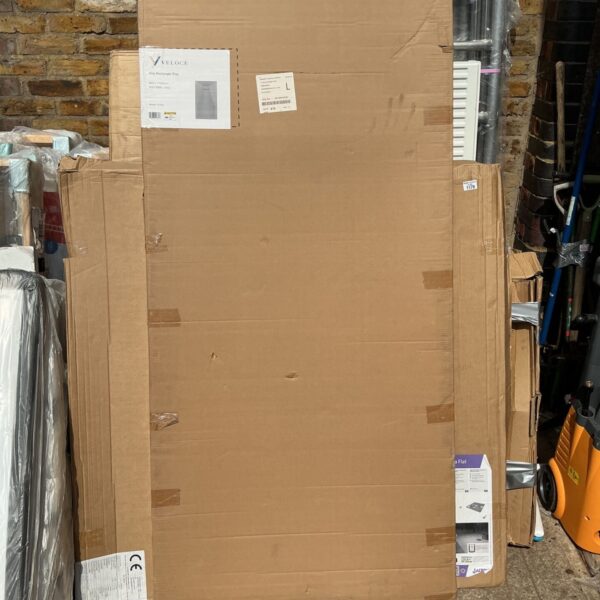 Grey Veloce Uno rectangle shower tray in original packaging.