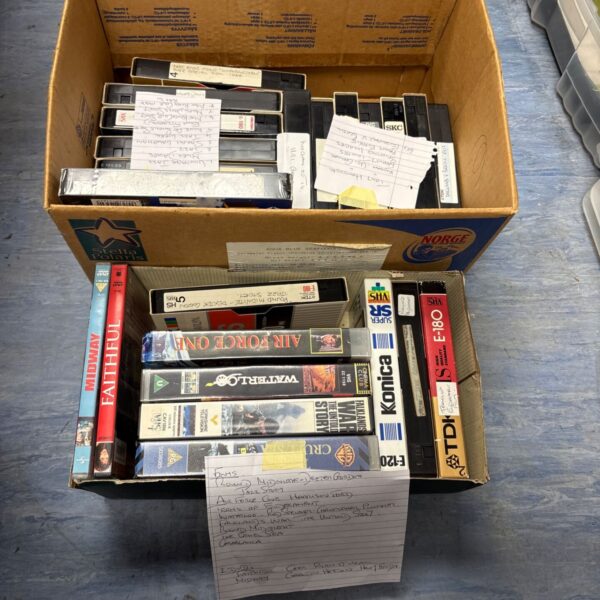 Boxed VHS tape collection including Tony Hancock films.