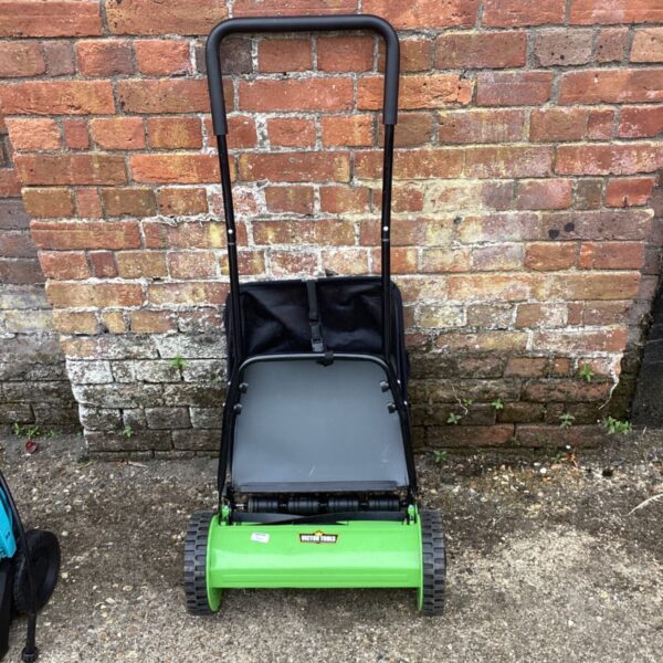 Green Victor Tools reel lawnmower with black grass catcher.