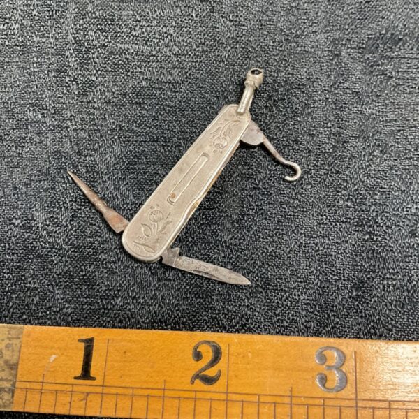 Antique Victorian chatelaine penknife with embossed detailing.