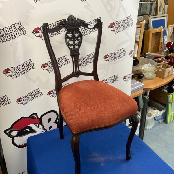 Antique Victorian Rococo Revival side chair with floral upholstery.