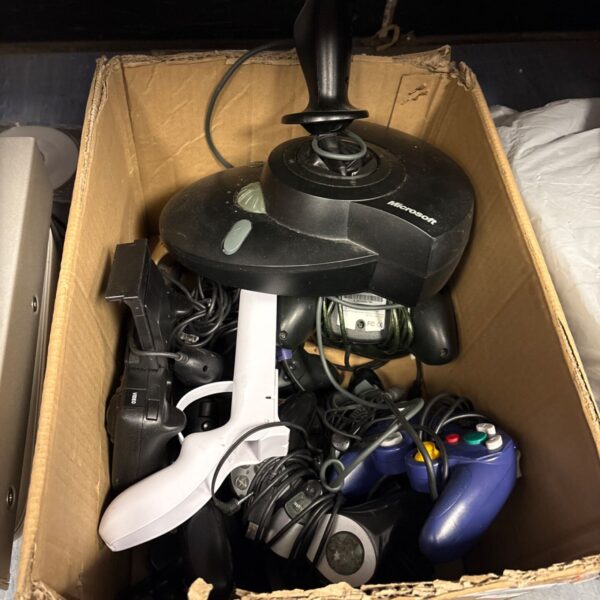 Lot of assorted video game controllers and accessories for Xbox and PlayStation.