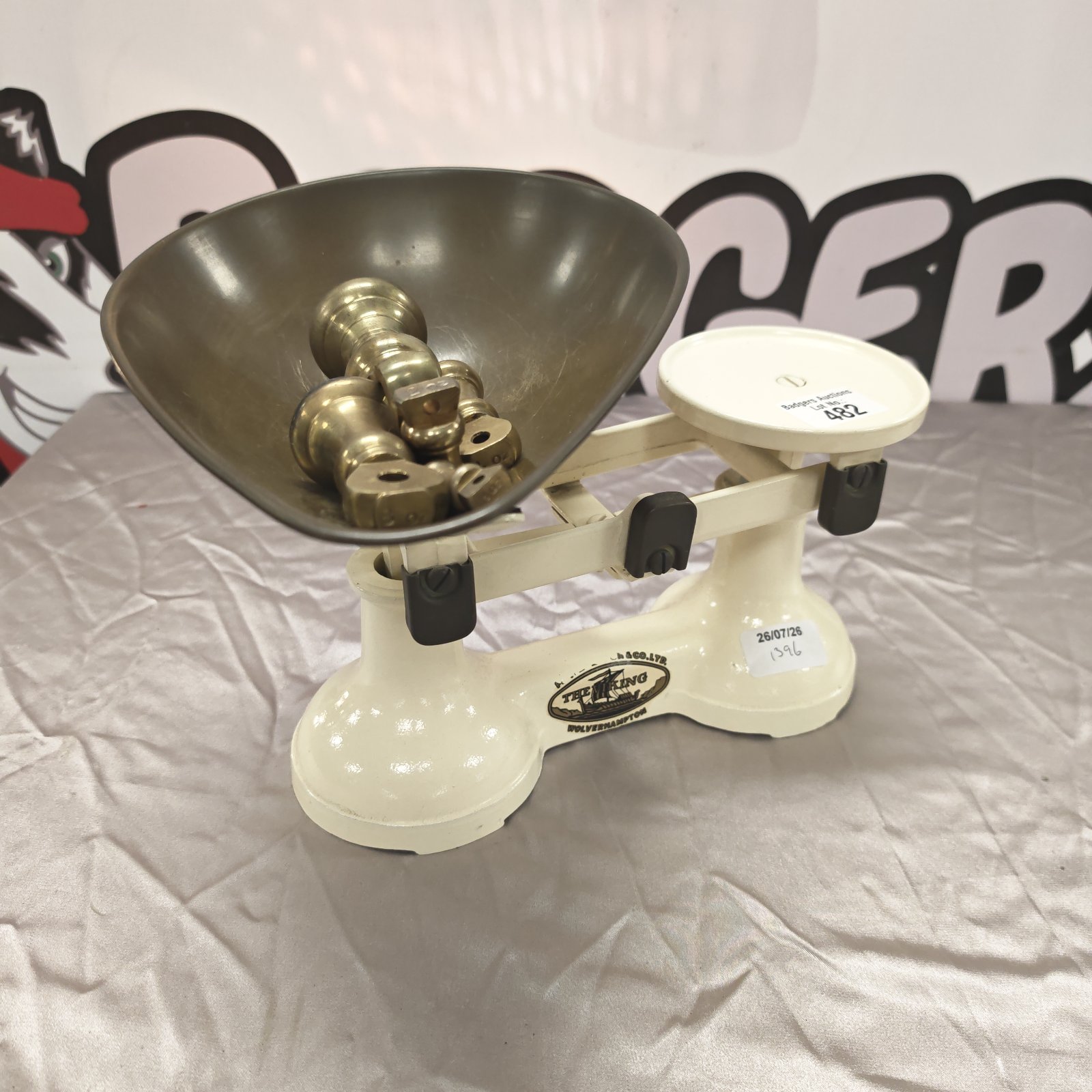 Vintage Viking weighing scales with brass weights for accurate measurement.