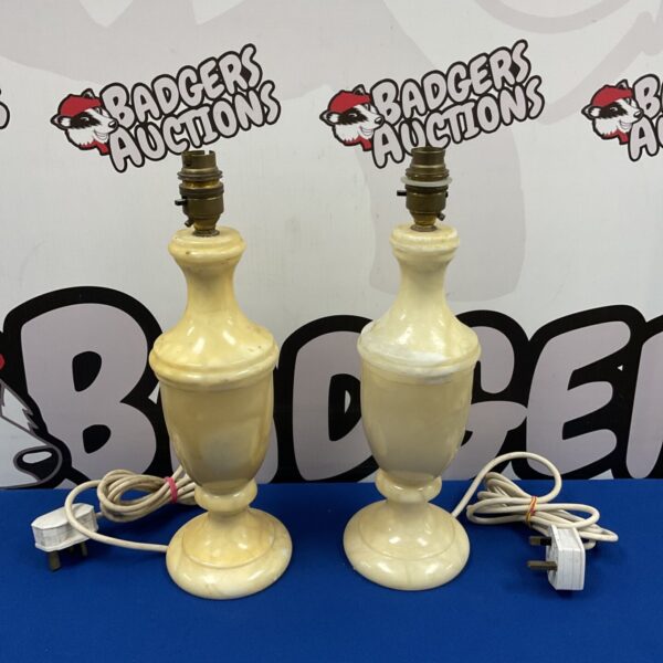 Pair of vintage alabaster urn table lamps with electrical cords.