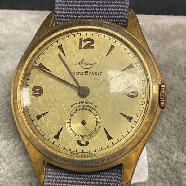 Vintage Anew wristwatch with a cream dial and gold case.