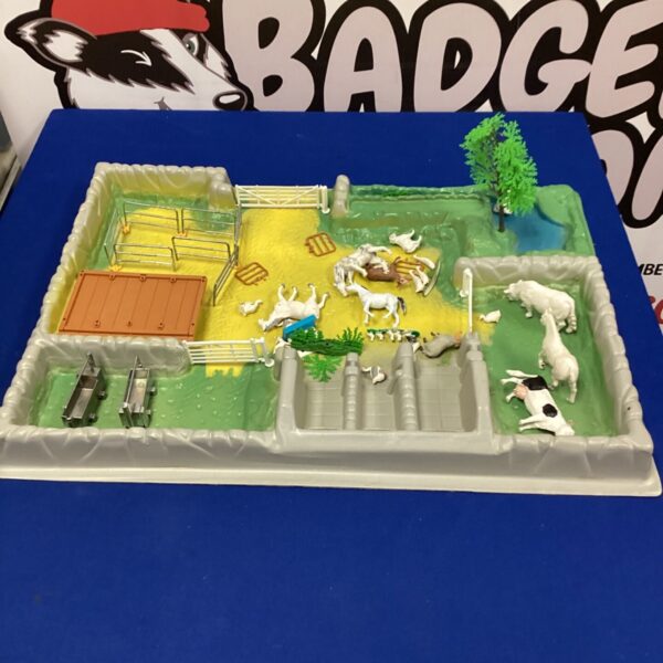 Vintage animal farm playset with cows, sheep, and horses.