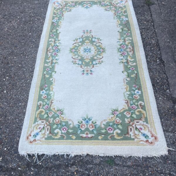 Vintage Aubusson style rug with cream and green floral design.