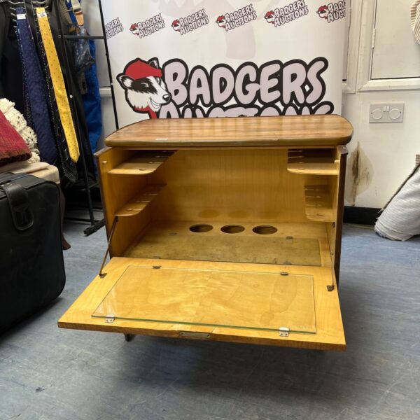 Vintage 1960s bar cabinet with drop-down front open.