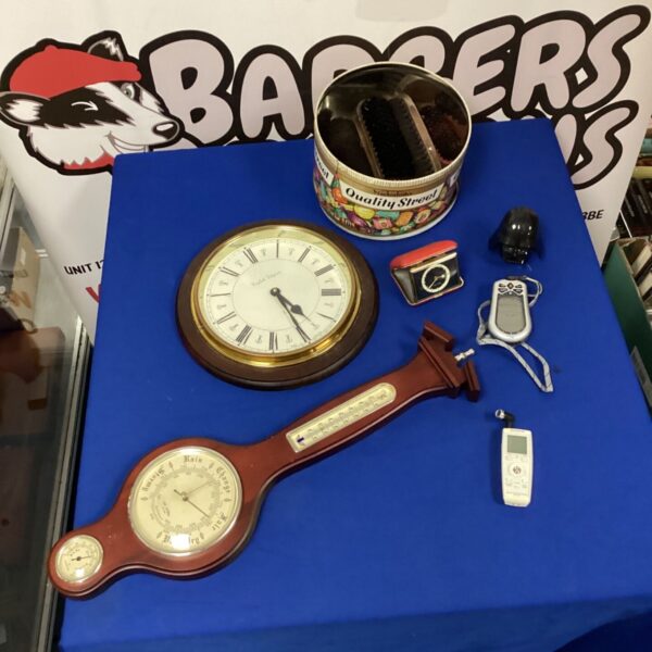 Vintage barometer clock set on display, antique home decor.