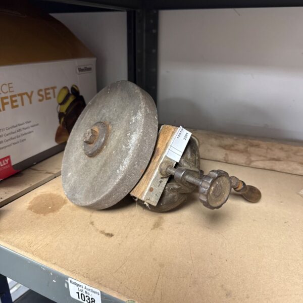 Vintage bench grinder wheel for metalworking and tool sharpening.