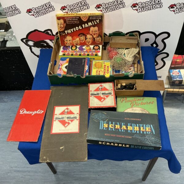 Vintage board games lot including Monopoly, Scrabble and Draughts.