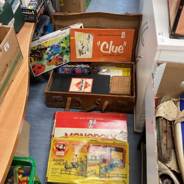 Vintage board game lot including Monopoly, Risk and Mickey Mouse Ranch.