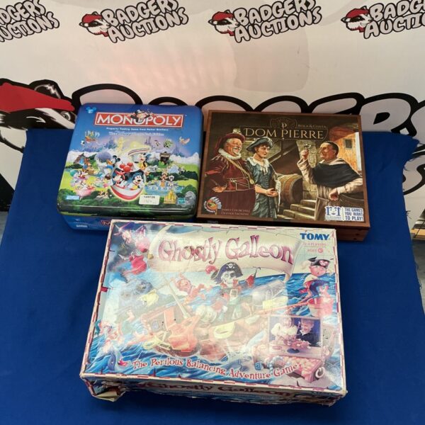 Vintage board games lot including Disney Monopoly and Ghostly Galleon.