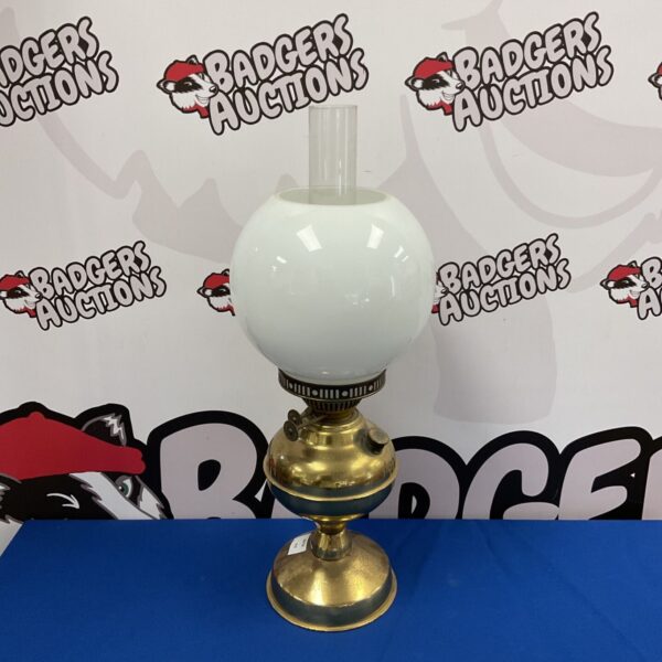 Vintage brass duplex oil lamp with clear glass shade.