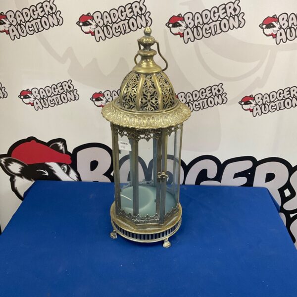 Ornate vintage brass lantern with pierced detailing.