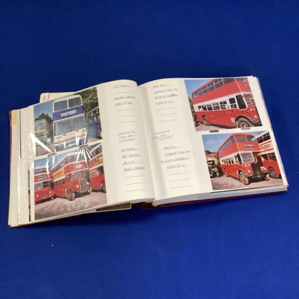 Vintage bus photo album filled with transport history images.