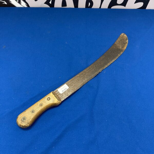 Vintage bush knife with wooden handle, showing signs of wear.