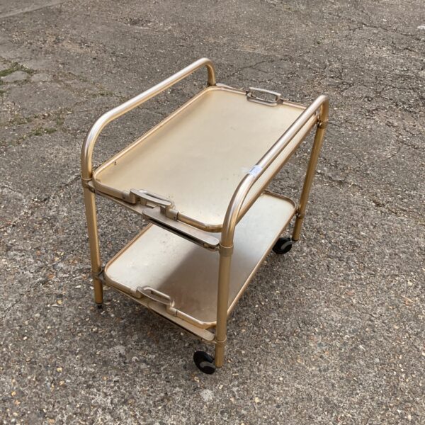 Gold vintage butlers trolley with two tiers.