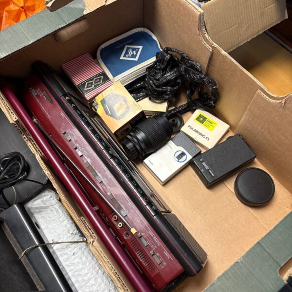 Vintage Toshiba boombox and camera accessories in a mixed lot.