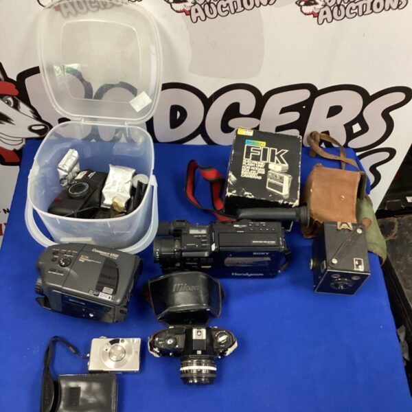 Vintage camera collection including Nikon, Sony, and Canon cameras.
