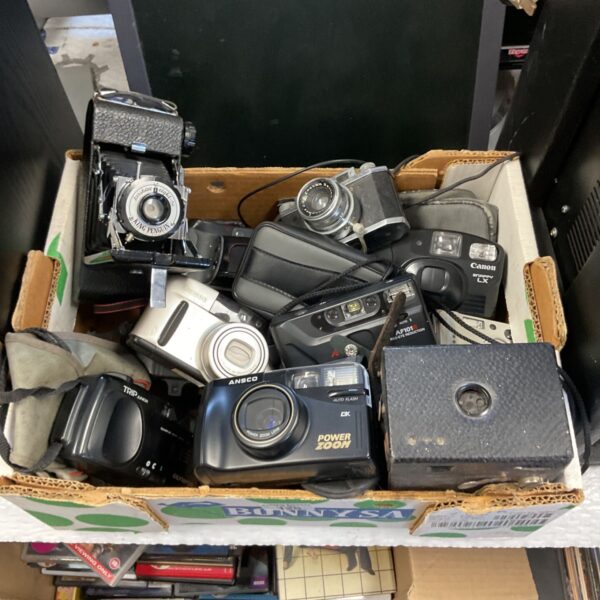 Vintage camera lot including Canon, Minolta and King Penguin cameras.