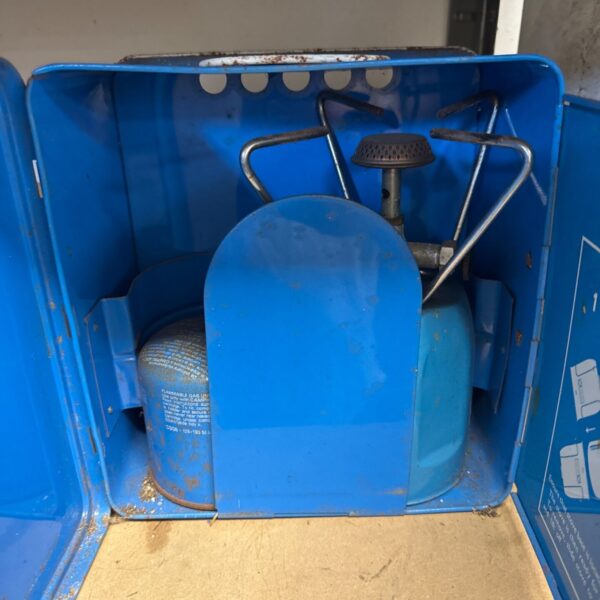 Vintage blue enamel Camping Gaz portable stove for outdoor cooking.