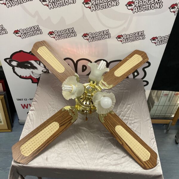 Vintage ceiling fan with light and wooden blades.