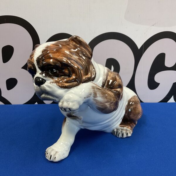 Vintage ceramic bulldog figurine with brown and white markings.