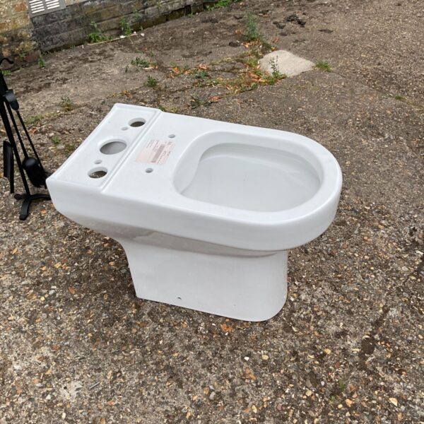 Vintage ceramic toilet, a classic bathroom fixture for restoration.