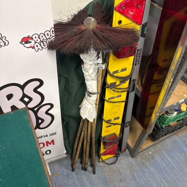 Vintage chimney sweeping rods made of bamboo, a classic cleaning tool.
