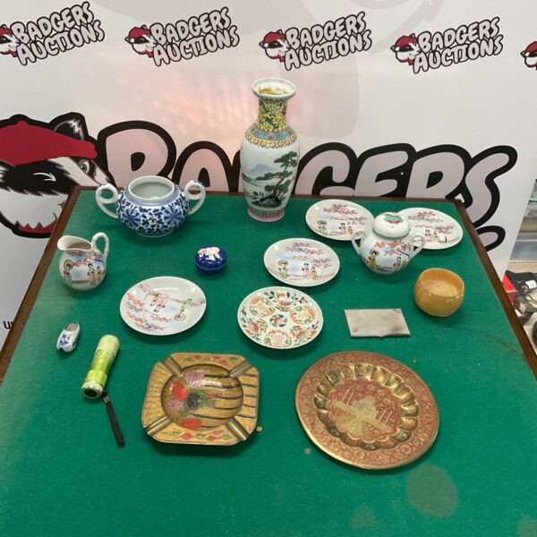 Vintage china collection with a colourful Japanese vase on display.