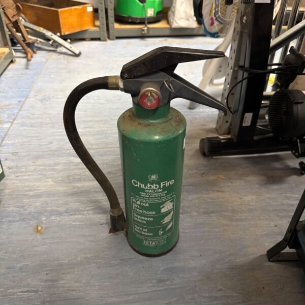 Vintage Chubb halon fire extinguisher showing pressure gauge.