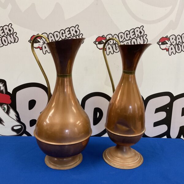 Pair of vintage copper ewers, 38cm tall, displayed on a patterned background.