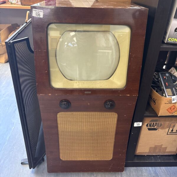 Vintage Cossor console television in wooden cabinet.