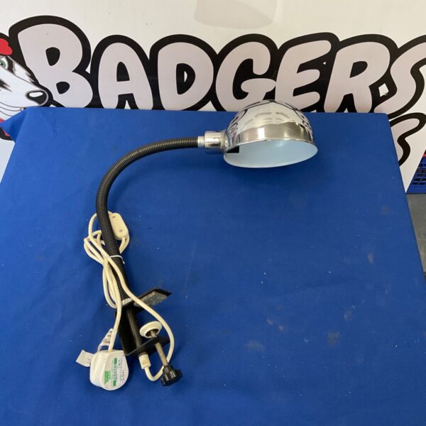 Vintage desk lamp with flexible gooseneck and clamp base.