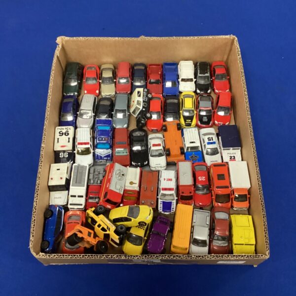 Vintage diecast car lot with mixed toy cars and Matchbox vehicles.