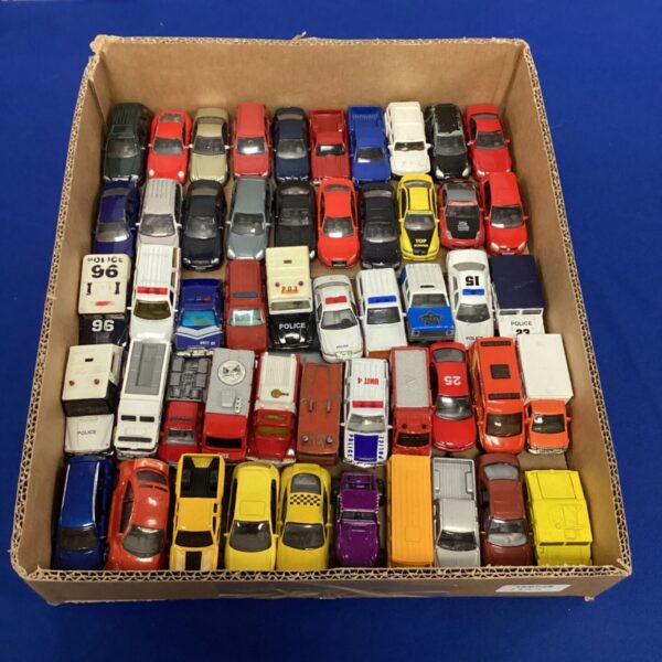 Vintage diecast vehicle lot with various American toy cars and trucks.